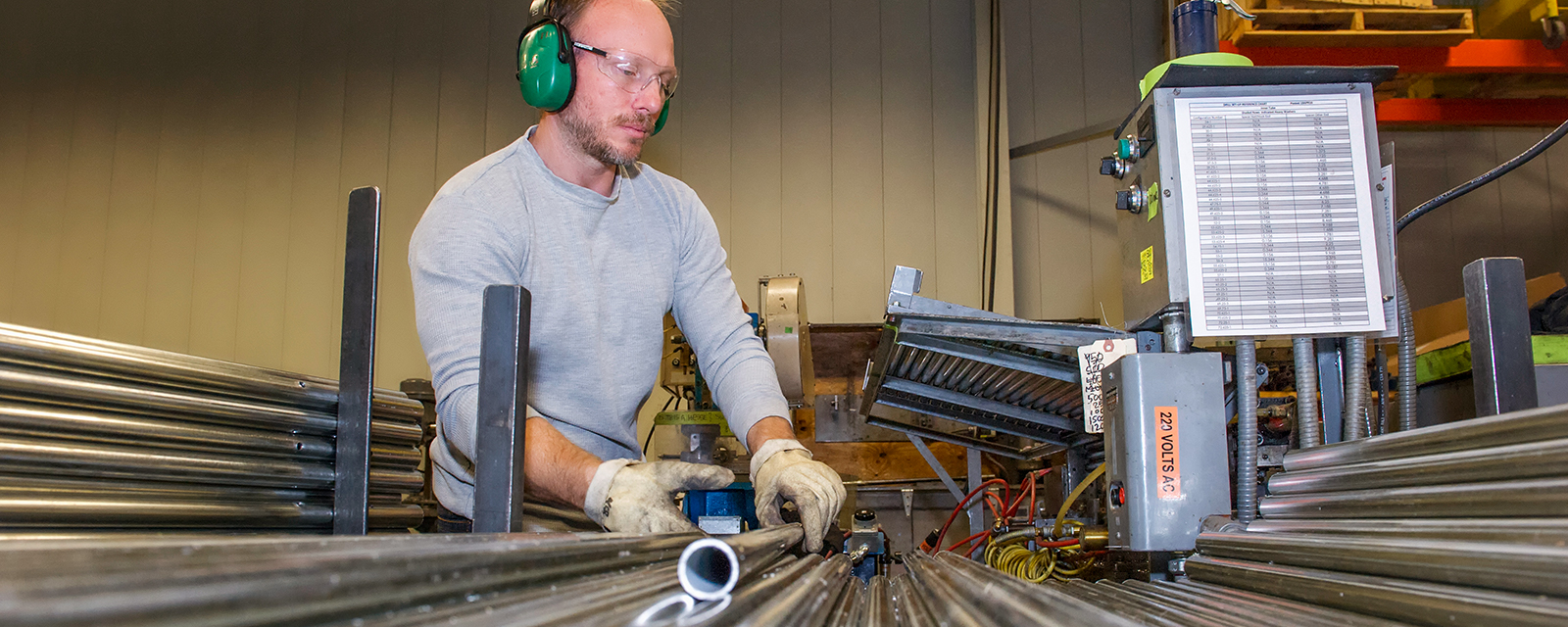 man working with metal pipes