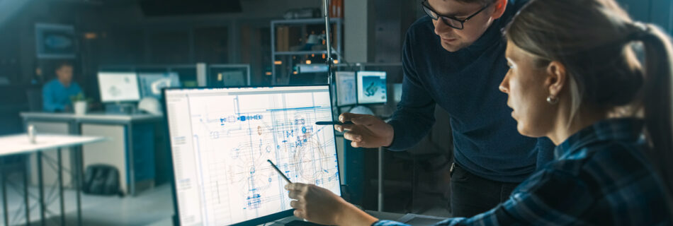 people looking at blue print on computer screen
